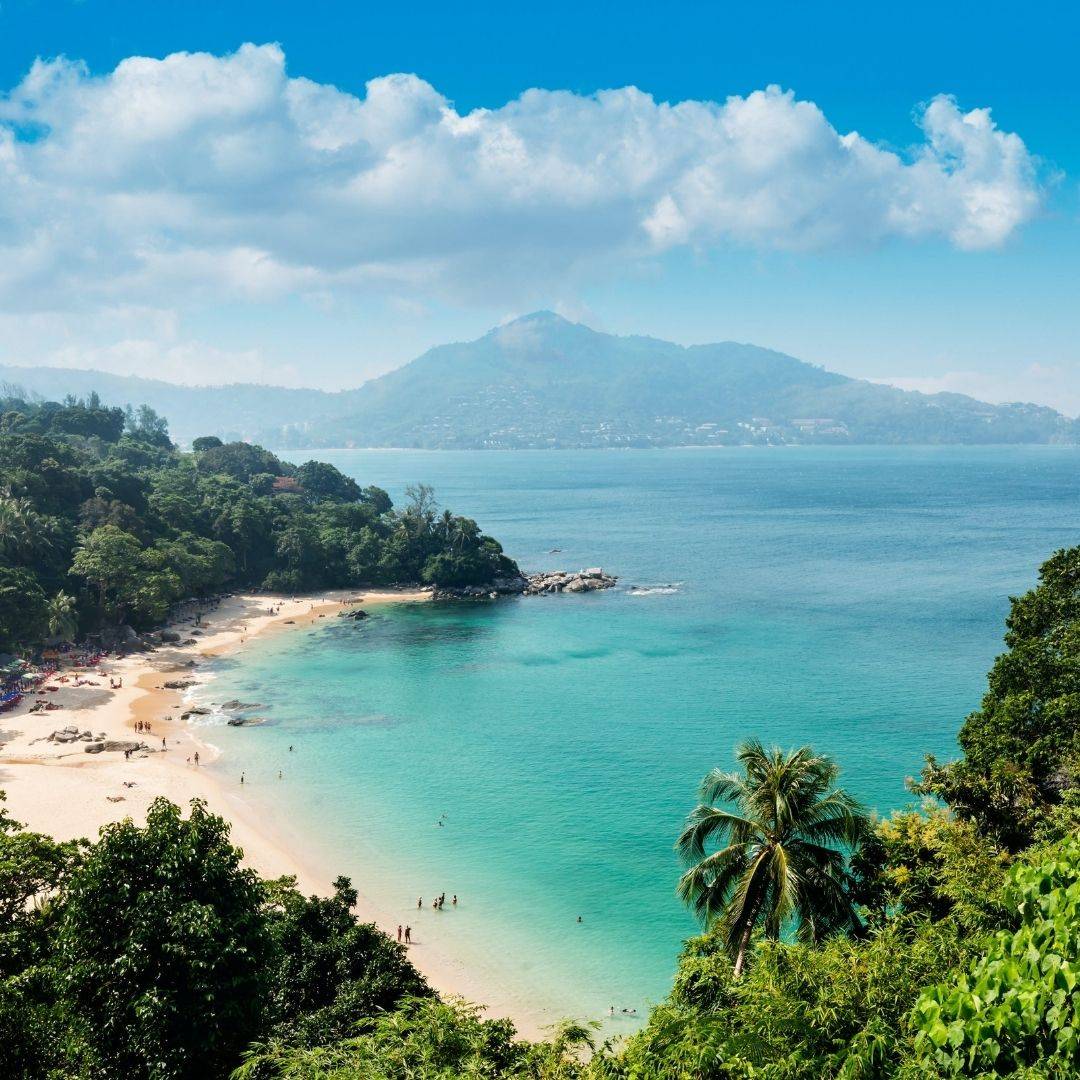 Ao Yon beach — turquoise water, jungle headland, mountain backdrop